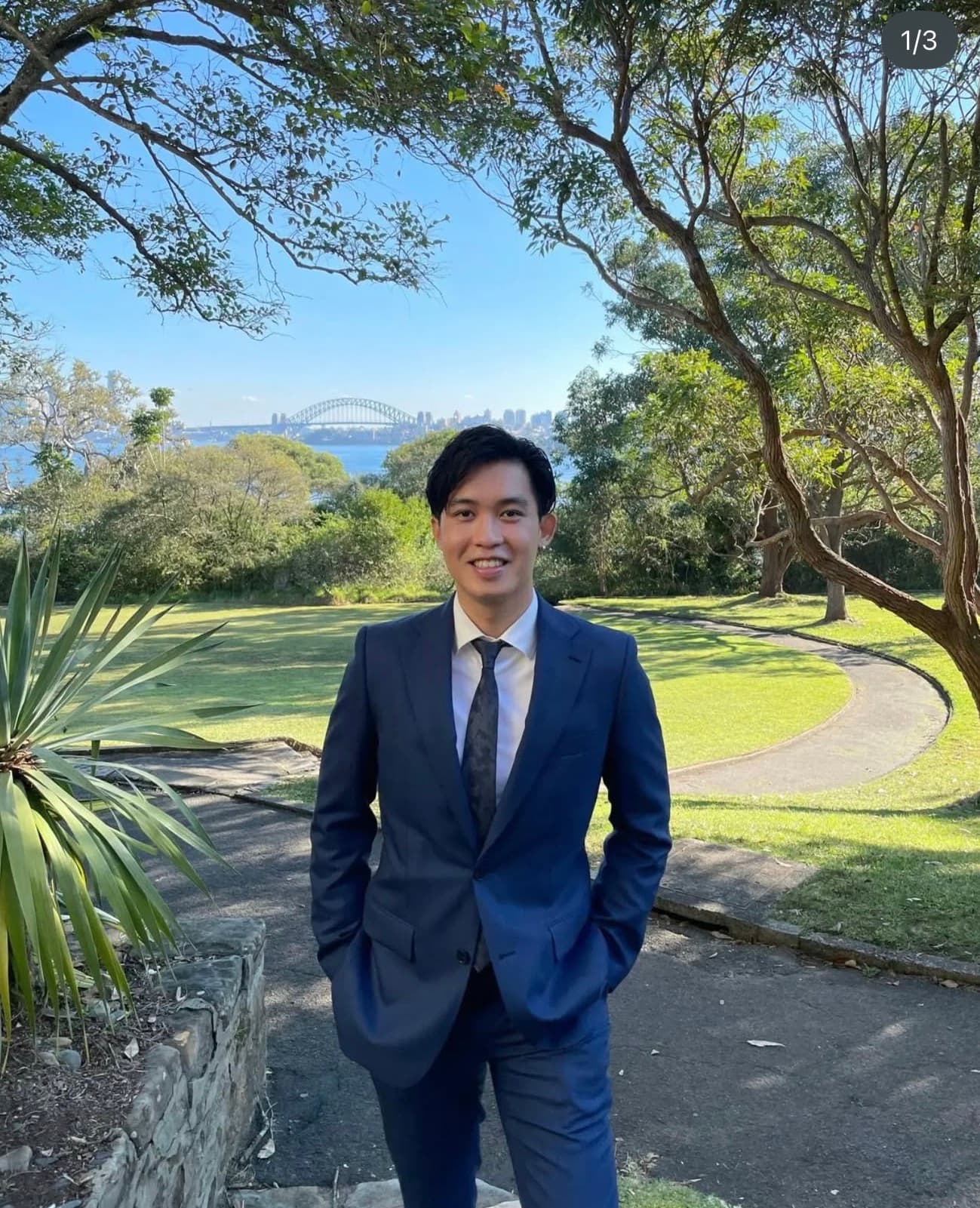 Ed in a suit at a Sydney Harbour lookout